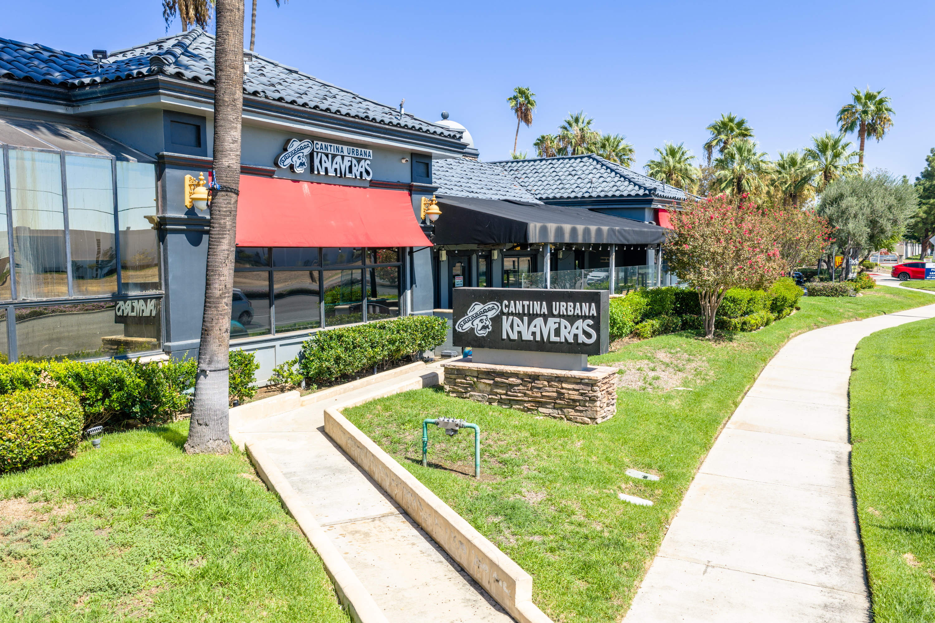 Plaza Del Sol's restaurant pad buildings with the parking lot and inline shops behind