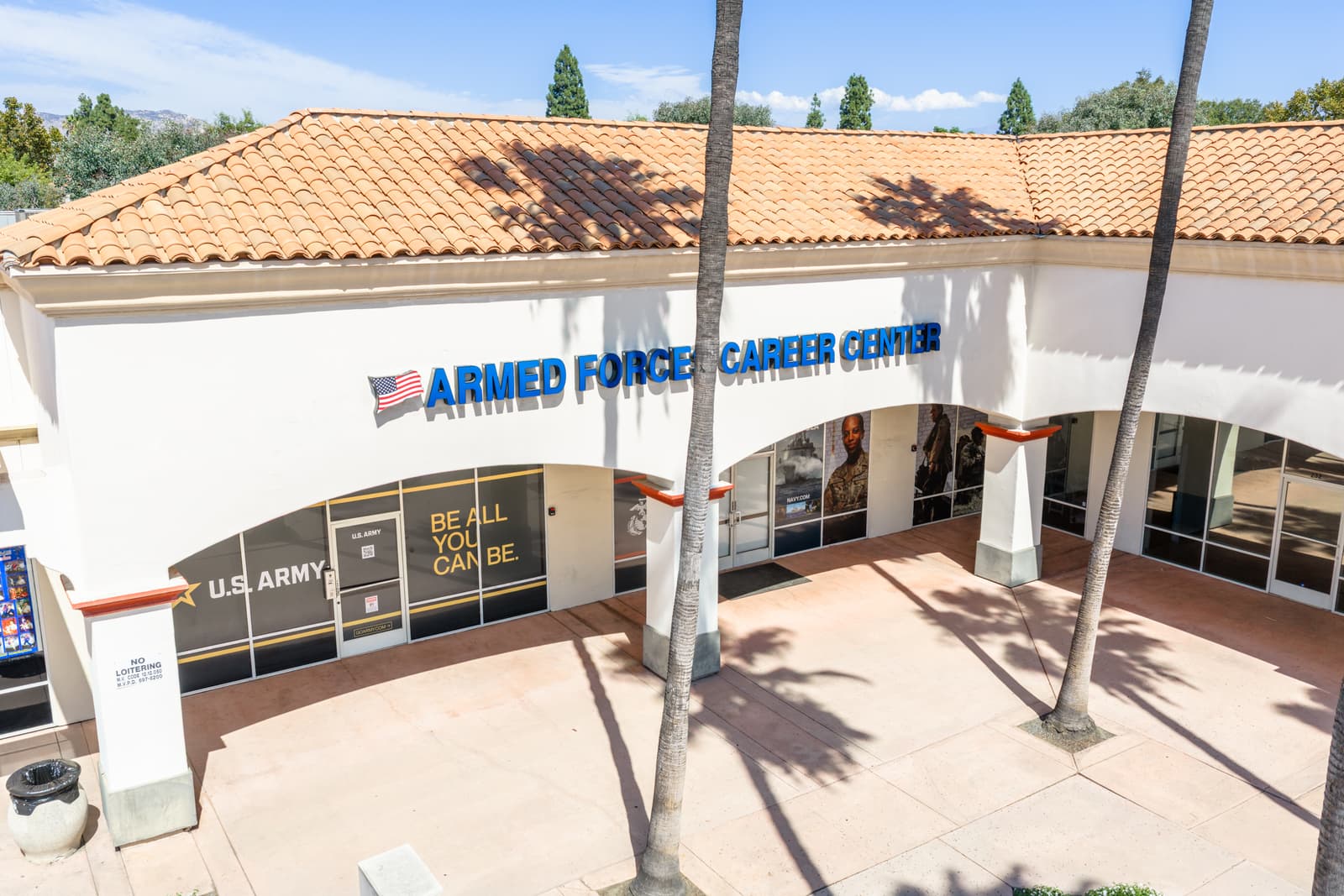 Armed Forces Career Center storefront at Plaza Del Sol under the arched arcade