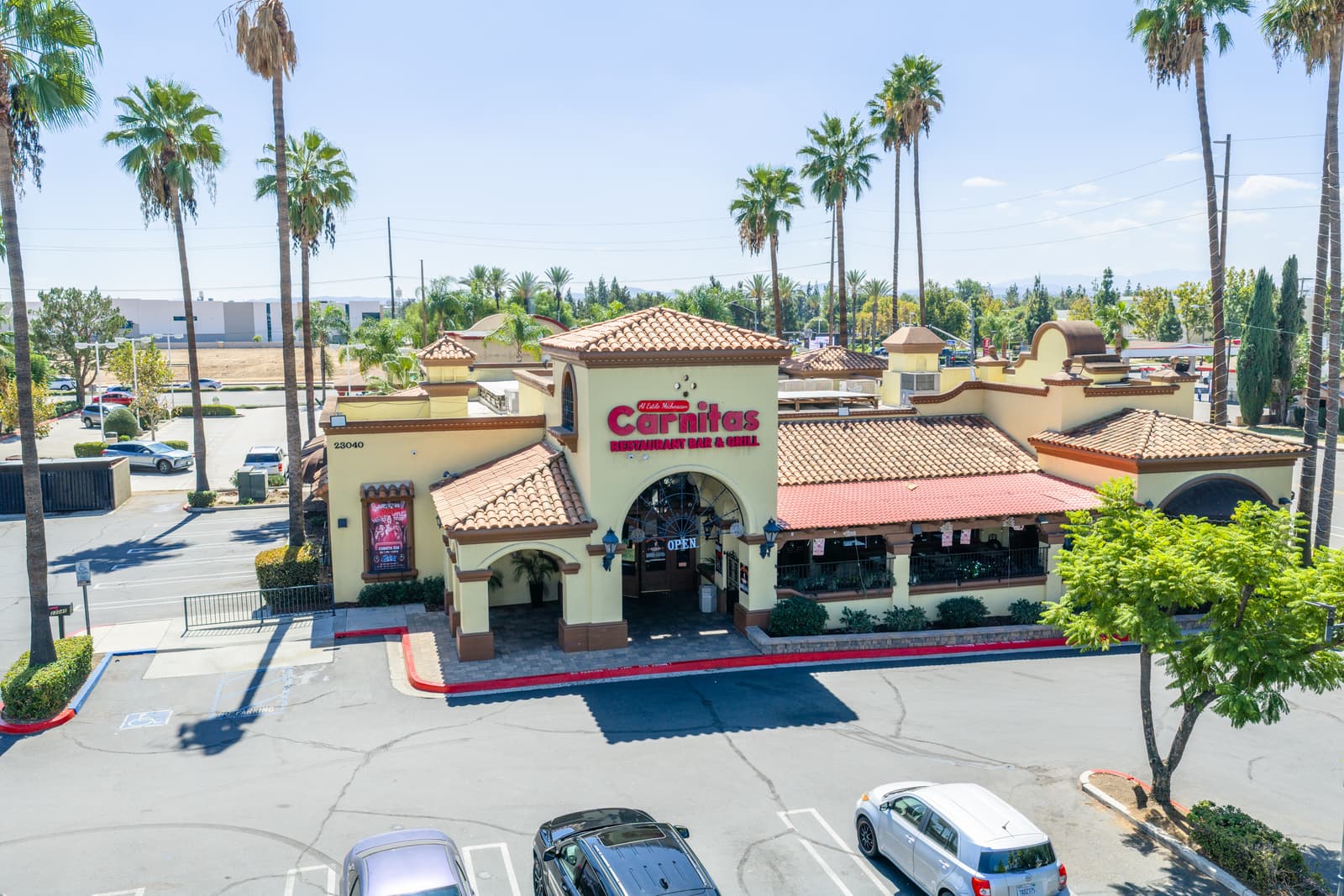 Carnitas restaurant pad at 23040 Alessandro Boulevard with its tile roof and outdoor seating