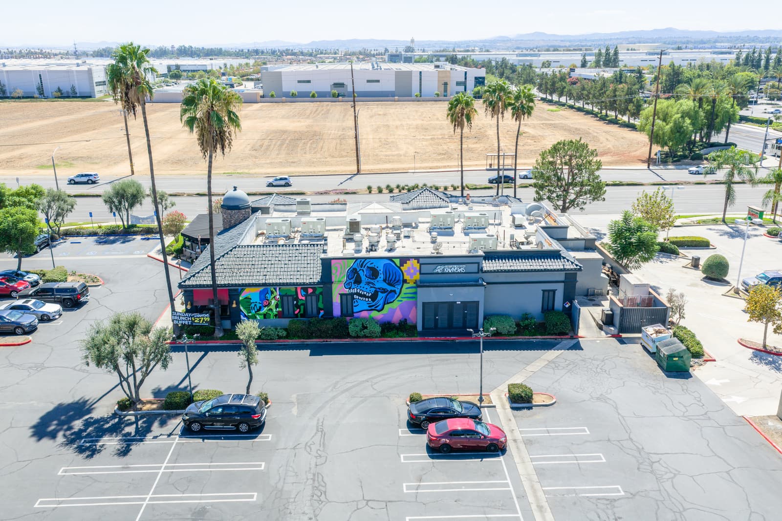 Kalaveras Cantina Urbana restaurant pad at Plaza Del Sol with its painted mural