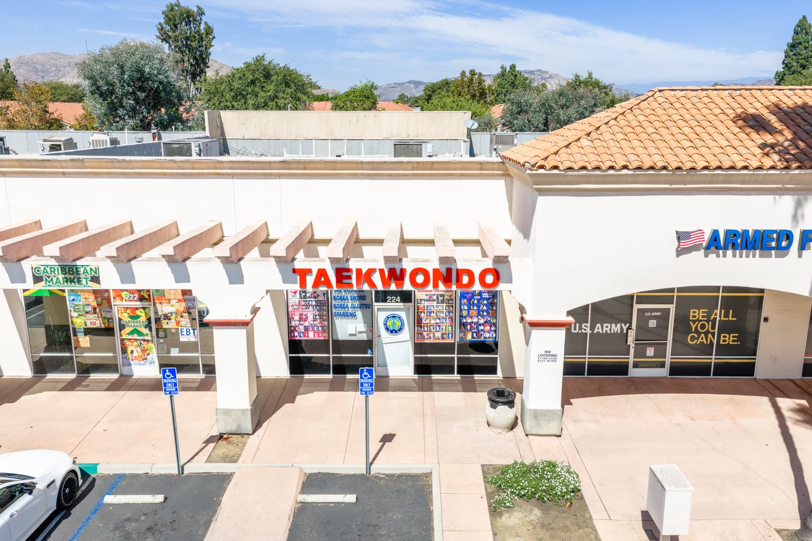 Taekwondo studio storefront at Plaza Del Sol next to the Armed Forces Career Center